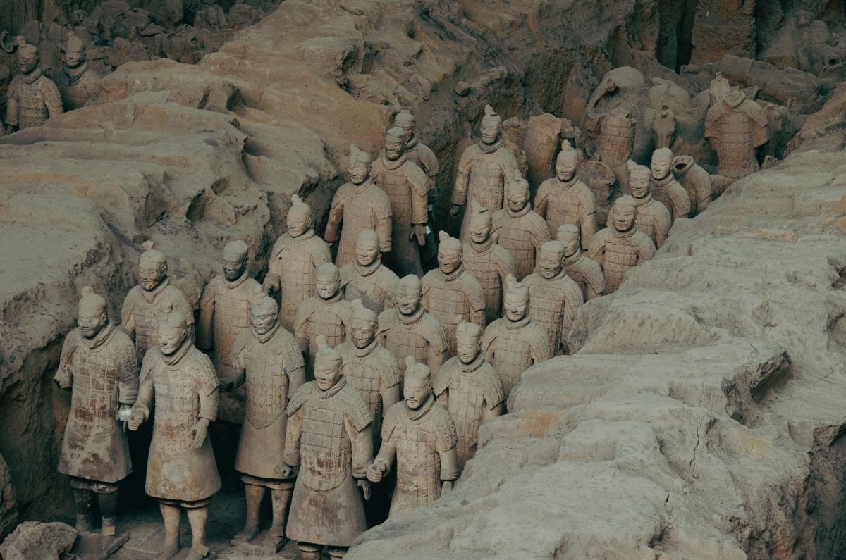 Terracotta Warriors excavation site in Xi'an, China, showcasing ancient clay statues of soldiers.