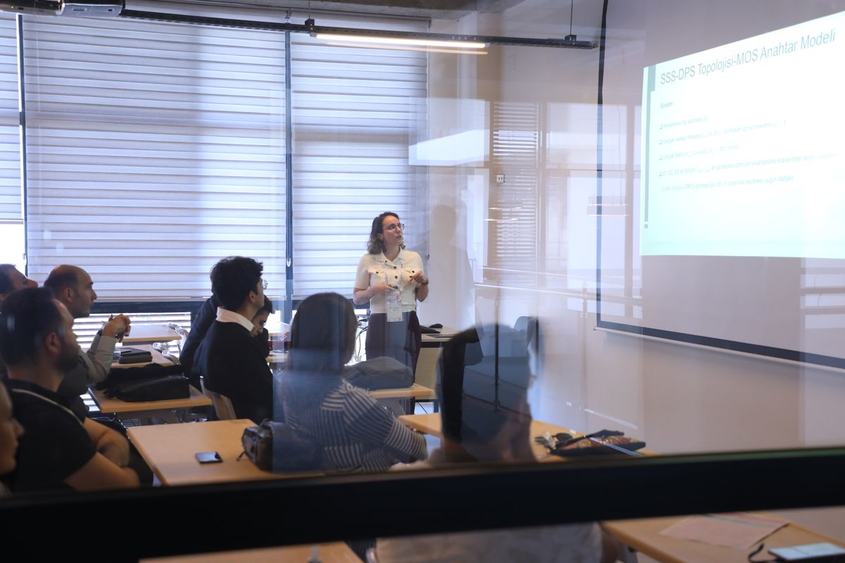 Audience attending a business presentation in a modern office environment.